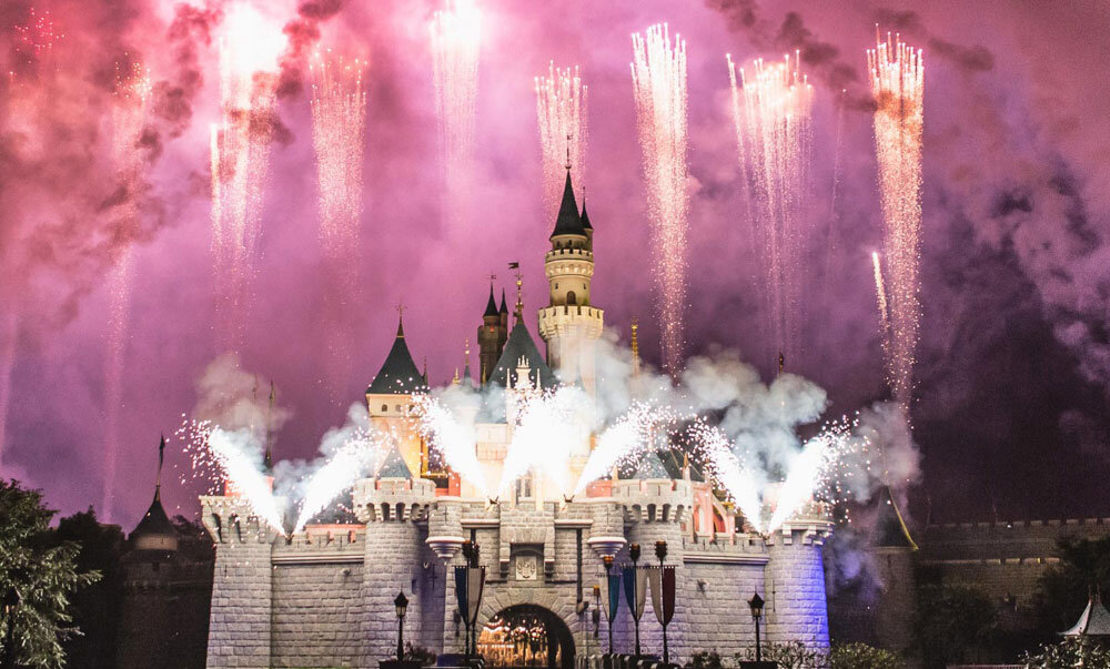 A castle with fireworks exploding in the background